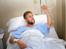 angry patient man at hospital room lying in bed pressing nurse call button feeling nervous and upset